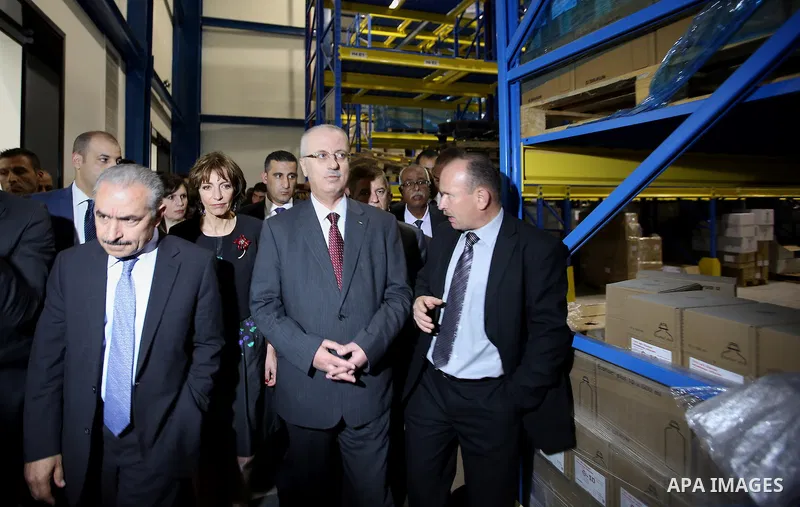 Palestinian Prime Minister, Rami Hamdallah, attends the inauguration ceremony of the Central Medical Stores, funded by the French Development Agency, in the West Bank city of Nablus, on April 2, 2016. Photo by Prime Mini...
