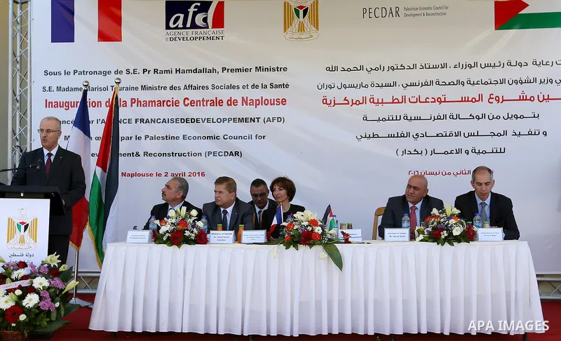 Palestinian Prime Minister, Rami Hamdallah, attends the inauguration ceremony of the Central Medical Stores, funded by the French Development Agency, in the West Bank city of Nablus, on April 2, 2016. Photo by Prime Mini...