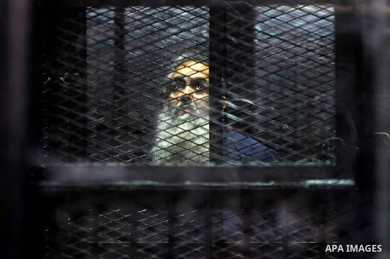 Egypt's Salafi leader and former presidential candidate Hazem Salah Abu Ismail looks on from the defendant cage during his trial in Cairo on April 2, 2016. An egyptian court considers today, Saturday the first trial sess...