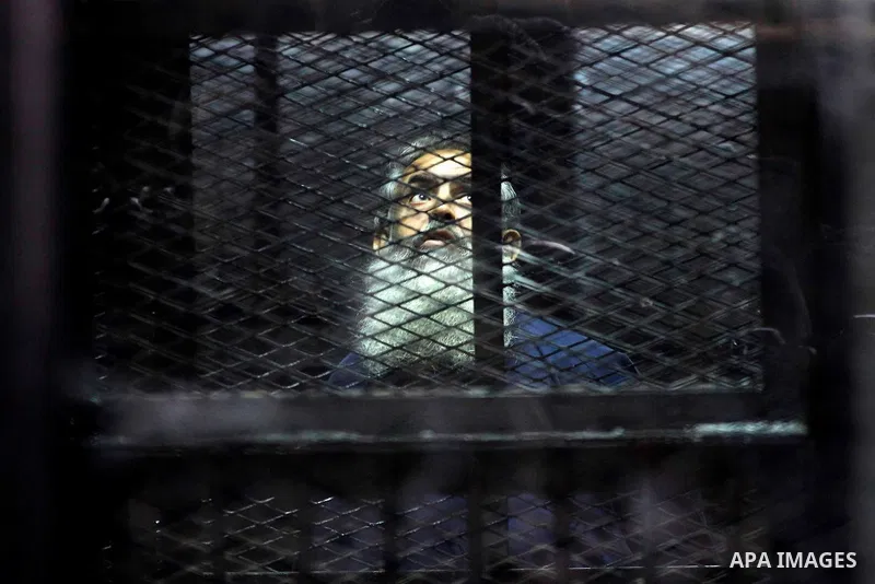 Egypt's Salafi leader and former presidential candidate Hazem Salah Abu Ismail looks on from the defendant cage during his trial in Cairo on April 2, 2016. An egyptian court considers today, Saturday the first trial sess...