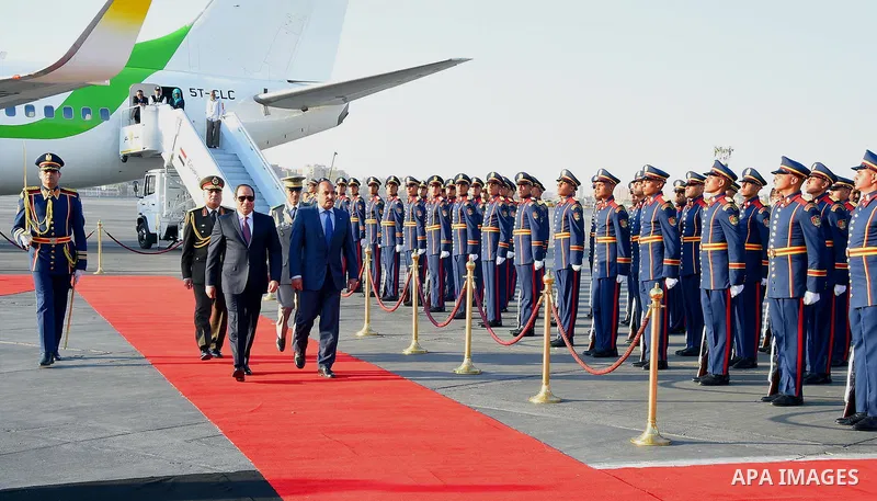 A handout picture released by the Egyptian Presidency on April 2, 2016 shows Egyptian President Abdel Fattah al-Sisi welcoming Mauritania President Mohamed Ould Abdel Aziz upon his arrival at Cairo International Airport....