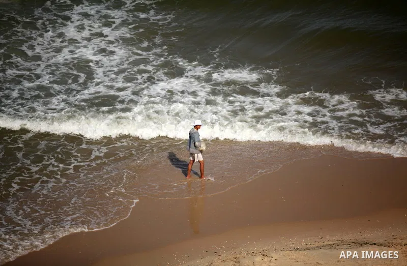 Palestinian fishermen work at the beach in Dair Al Balah in the center of Gaza strip on April 03, 2016. Israel on Sunday extended the distance it permits Gaza fishermen to head out to sea along certain parts of the coast...