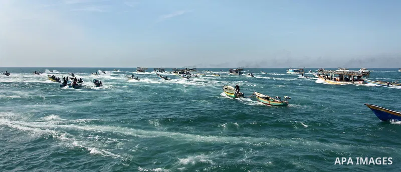 Palestinian fishermen ride their fishing boat at the beach of Gaza City on April 03, 2016. Israel on Sunday extended the distance it permits Gaza fishermen to head out to sea along certain parts of the coastline of the e...