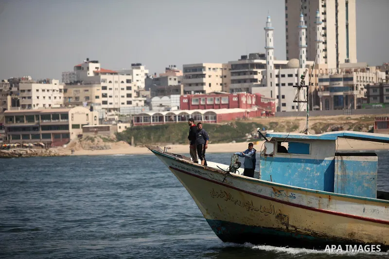 Palestinian fishermen ride their fishing boat at the beach of Gaza City on April 03, 2016. Israel on Sunday extended the distance it permits Gaza fishermen to head out to sea along certain parts of the coastline of the e...