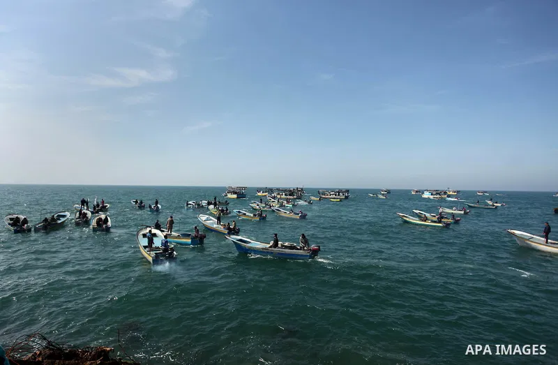 Palestinian fishermen ride their fishing boat at the beach of Gaza City on April 03, 2016. Israel on Sunday extended the distance it permits Gaza fishermen to head out to sea along certain parts of the coastline of the e...