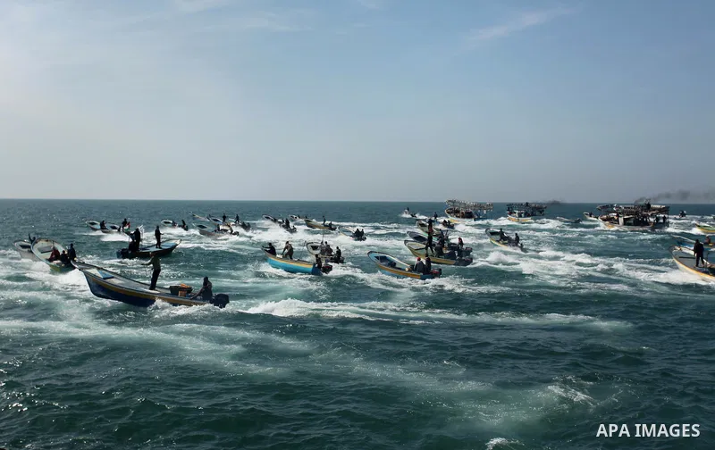 Palestinian fishermen ride their fishing boat at the beach of Gaza City on April 03, 2016. Israel on Sunday extended the distance it permits Gaza fishermen to head out to sea along certain parts of the coastline of the e...