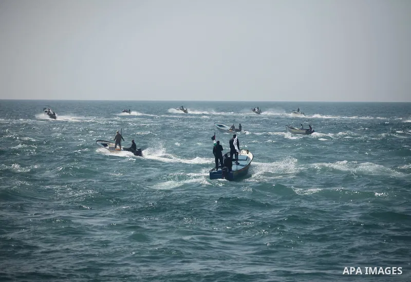 Palestinian fishermen ride their fishing boat at the beach of Gaza City on April 03, 2016. Israel on Sunday extended the distance it permits Gaza fishermen to head out to sea along certain parts of the coastline of the e...