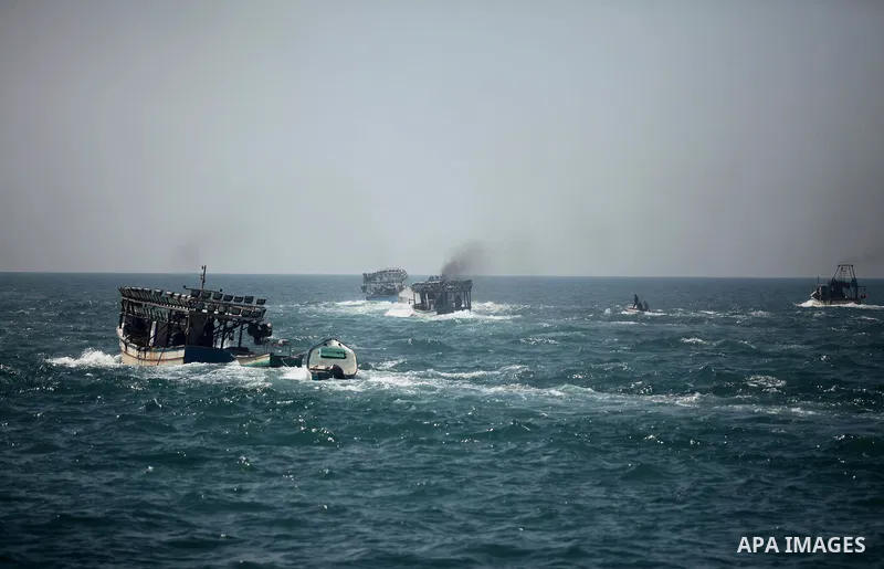 Palestinian fishermen ride their fishing boat at the beach of Gaza City on April 03, 2016. Israel on Sunday extended the distance it permits Gaza fishermen to head out to sea along certain parts of the coastline of the e...