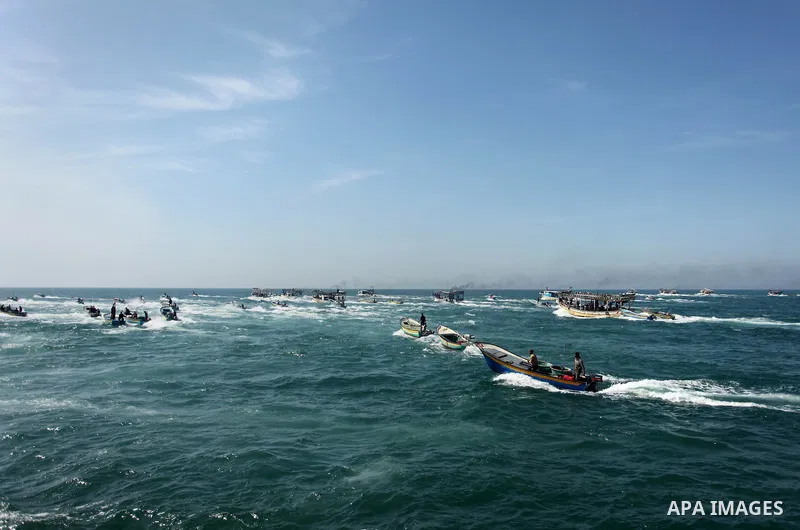 Palestinian fishermen ride their fishing boat at the beach of Gaza City on April 03, 2016. Israel on Sunday extended the distance it permits Gaza fishermen to head out to sea along certain parts of the coastline of the e...