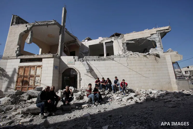 Palestinians inspect the rubble of of their house that were demolished by the Israeli bulldozers, in the village of Qabatiya south of Jenin, on April 4, 2016. The three Palestinians to whom the houses belonged were shot...