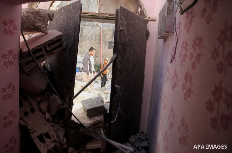 Palestinians inspect the rubble of of their house that were demolished by the Israeli bulldozers, in the village of Qabatiya south of Jenin, on April 4, 2016. The three Palestinians to whom the houses belonged were shot...