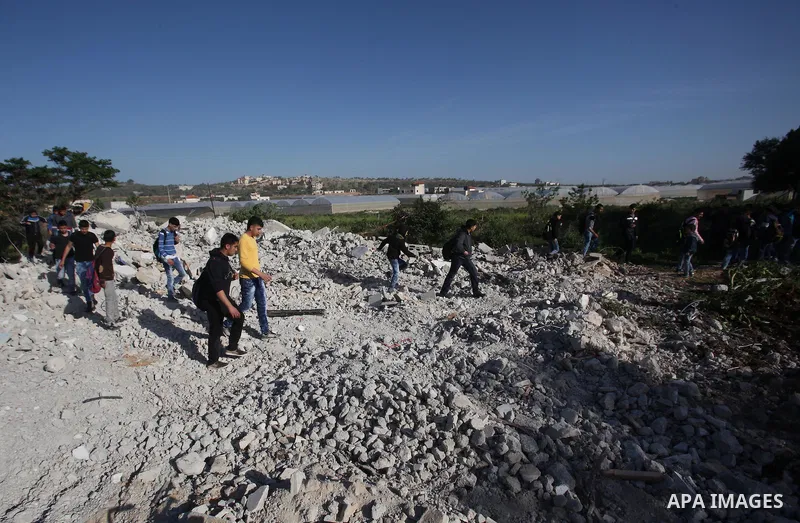 Palestinians inspect the rubble of of their house that were demolished by the Israeli bulldozers, in the village of Qabatiya south of Jenin, on April 4, 2016. The three Palestinians to whom the houses belonged were shot...