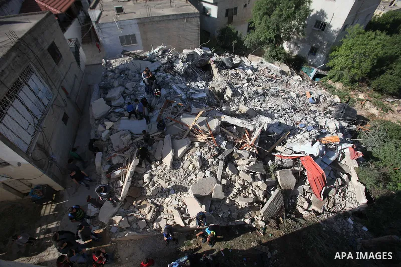 Palestinians inspect the rubble of of their house that were demolished by the Israeli bulldozers, in the village of Qabatiya south of Jenin, on April 4, 2016. The three Palestinians to whom the houses belonged were shot...