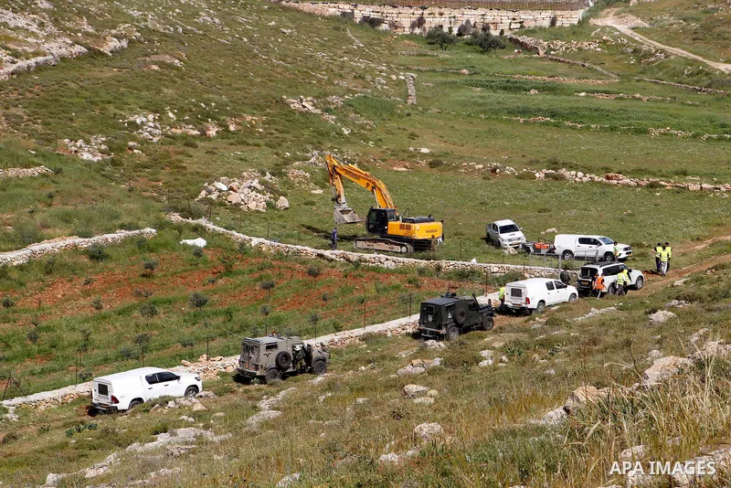Israeli troops stand guard as bulldozers demolish houses in the West Bank village of Um Alkahiar, South of Hebron 06 April 2016. Israeli forces on Wednesday demolished six structures in Khirbet Umm al-Kheir south of the...