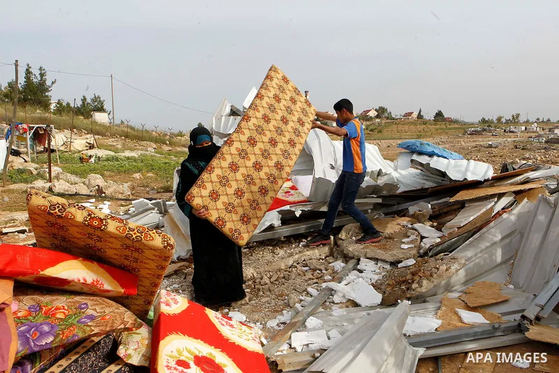 Palestinians inspect the rubble of a house that was demolished by Israeli bulldozers in the West Bank village of Um Alkahiar, South of Hebron 06 April 2016. Israeli forces on Wednesday demolished six structures in Khirbe...