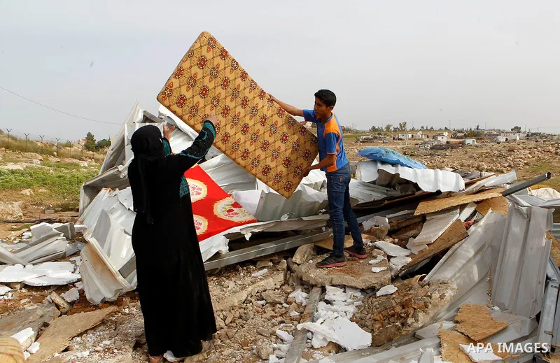 Palestinians inspect the rubble of a house that was demolished by Israeli bulldozers in the West Bank village of Um Alkahiar, South of Hebron 06 April 2016. Israeli forces on Wednesday demolished six structures in Khirbe...
