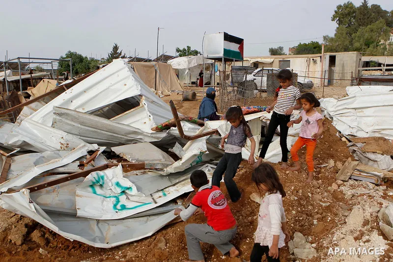 Palestinians inspect the rubble of a house that was demolished by Israeli bulldozers in the West Bank village of Um Alkahiar, South of Hebron 06 April 2016. Israeli forces on Wednesday demolished six structures in Khirbe...