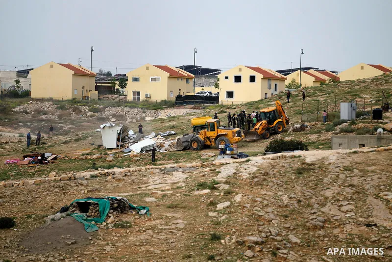 Israeli troops stand guard as bulldozers demolish houses in the West Bank village of Um Alkahiar, South of Hebron 06 April 2016. Israeli forces on Wednesday demolished six structures in Khirbet Umm al-Kheir south of the...