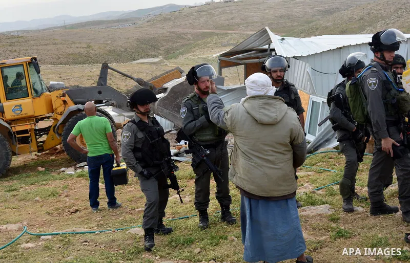 Israeli troops argue with palestinian man as bulldozers demolish houses in the West Bank village of Um Alkahiar, South of Hebron 06 April 2016. Israeli forces on Wednesday demolished six structures in Khirbet Umm al-Khei...