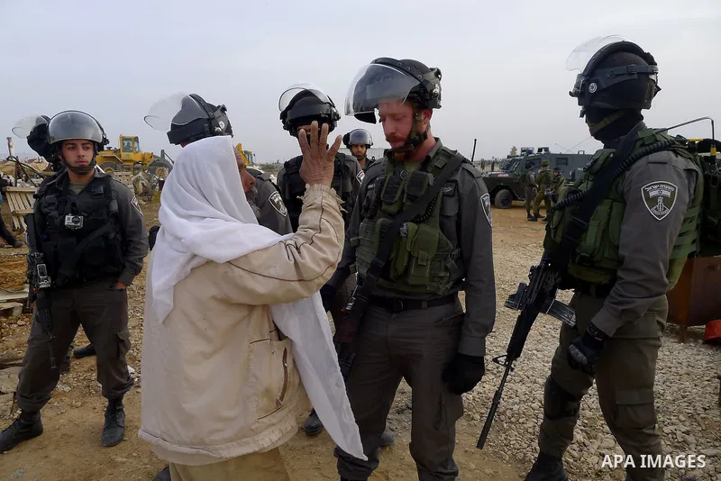 Israeli troops argue with palestinian man as bulldozers demolish houses in the West Bank village of Um Alkahiar, South of Hebron 06 April 2016. Israeli forces on Wednesday demolished six structures in Khirbet Umm al-Khei...