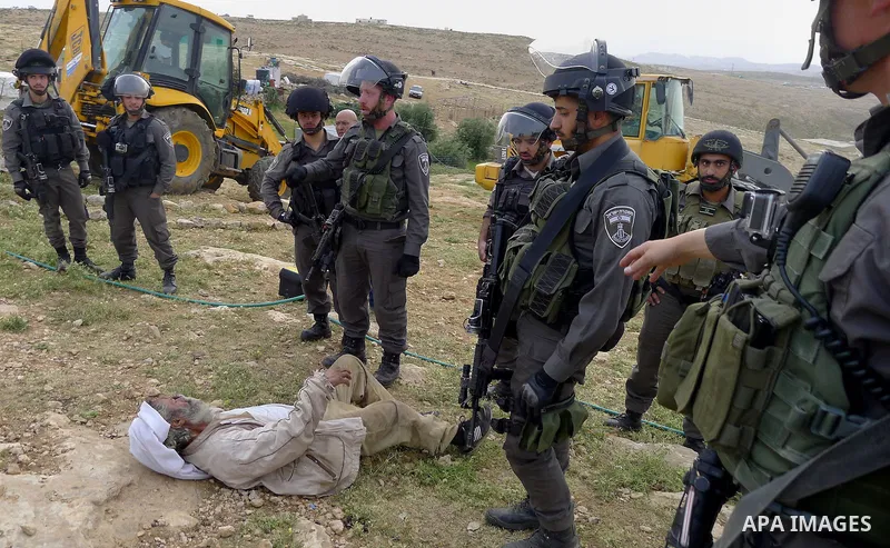 Israeli troops argue with palestinian man as bulldozers demolish houses in the West Bank village of Um Alkahiar, South of Hebron 06 April 2016. Israeli forces on Wednesday demolished six structures in Khirbet Umm al-Khei...