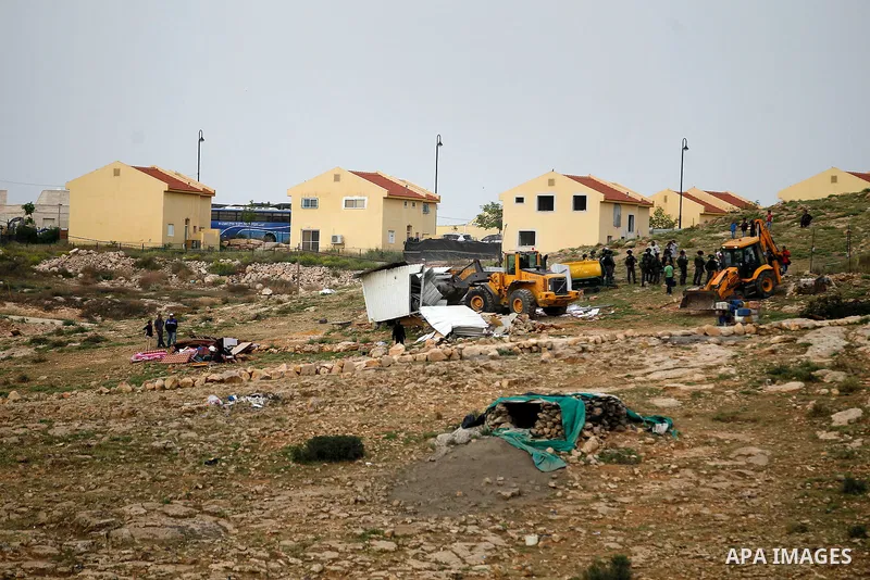 Israeli troops stand guard as bulldozers demolish houses in the West Bank village of Um Alkahiar, South of Hebron 06 April 2016. Israeli forces on Wednesday demolished six structures in Khirbet Umm al-Kheir south of the...