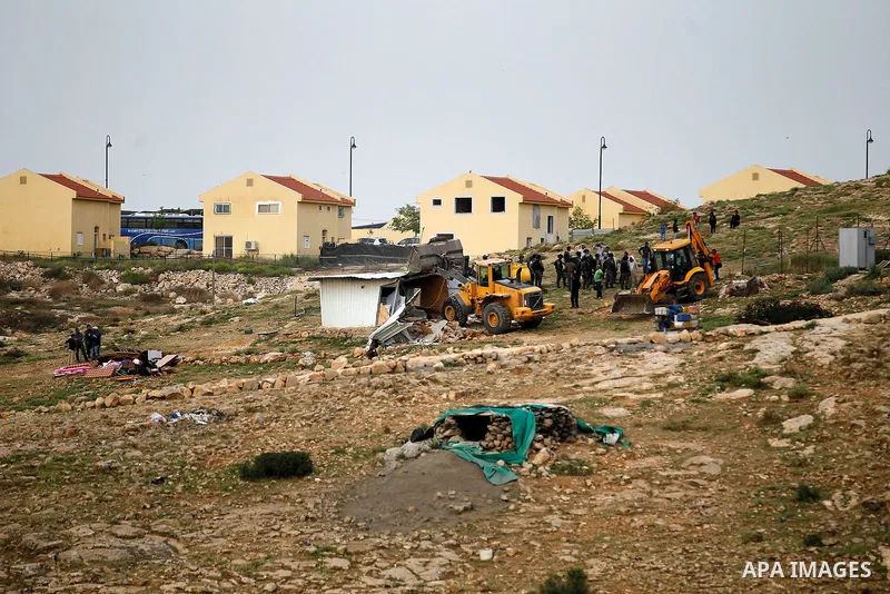 Israeli troops stand guard as bulldozers demolish houses in the West Bank village of Um Alkahiar, South of Hebron 06 April 2016. Israeli forces on Wednesday demolished six structures in Khirbet Umm al-Kheir south of the...