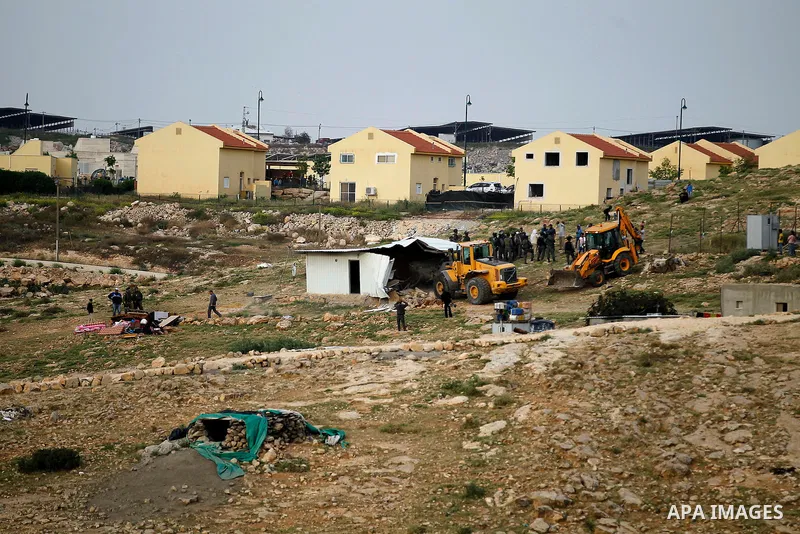 Israeli troops stand guard as bulldozers demolish houses in the West Bank village of Um Alkahiar, South of Hebron 06 April 2016. Israeli forces on Wednesday demolished six structures in Khirbet Umm al-Kheir south of the...