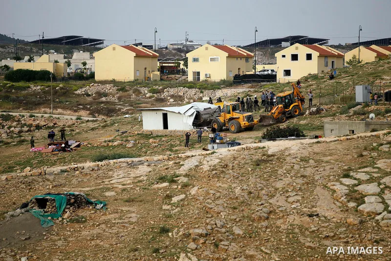 Israeli troops stand guard as bulldozers demolish houses in the West Bank village of Um Alkahiar, South of Hebron 06 April 2016. Israeli forces on Wednesday demolished six structures in Khirbet Umm al-Kheir south of the...