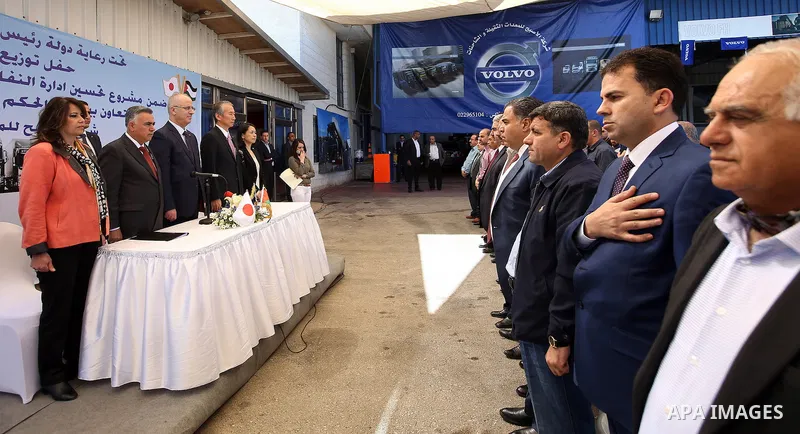 Palestinian Prime Minister, Rami Hamdallah, attends a ceremony of distribution of waste trucks, in the West Bank city of Ramallah, on April 7, 2016. Photo by Prime Minister Office