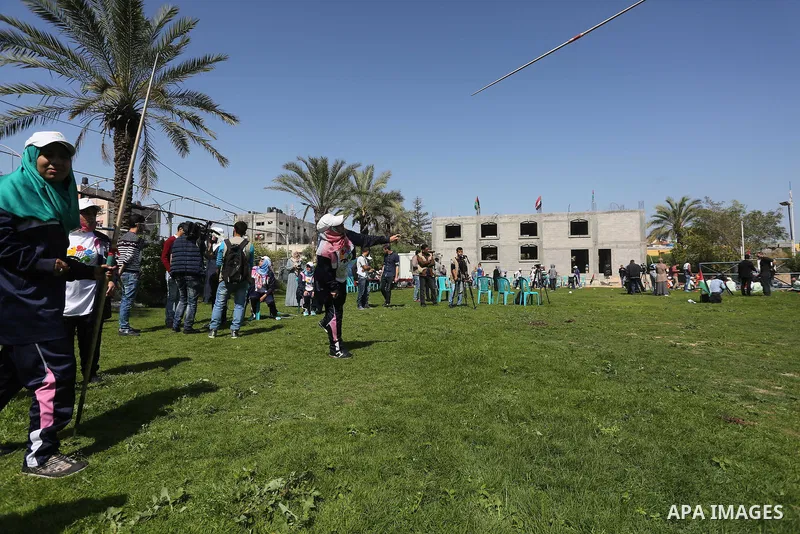 Disabled Palestinians play sitting volleyball during a local sports championship organized by Al Jazeera club in Gaza City April 7, 2016. Photo by Mohammed Asad