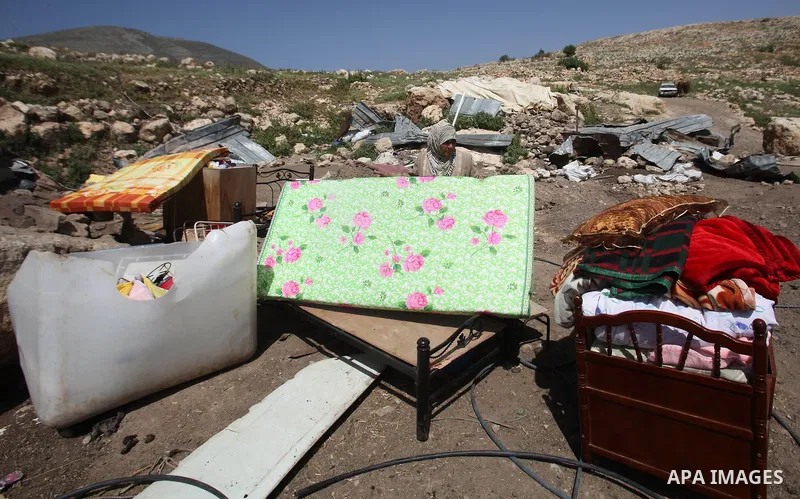 Palestinians inspect the rubble of a house that was demolished by Israeli bulldozers in the West Bank village of Khirbet Tana, south east of Nablus 07 April 2016. Khirbet Tana lies in an Israeli-declared military trainin...
