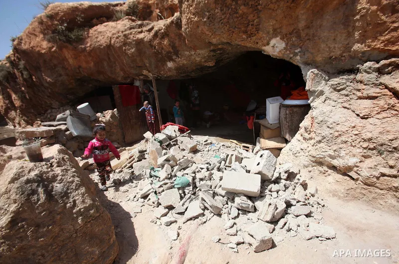 Palestinians inspect the rubble of a house that was demolished by Israeli bulldozers in the West Bank village of Khirbet Tana, south east of Nablus 07 April 2016. Khirbet Tana lies in an Israeli-declared military trainin...