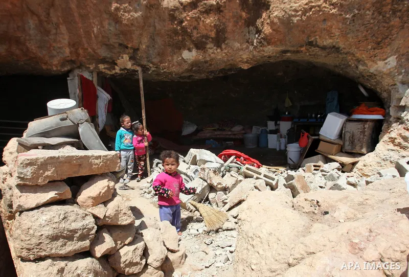 Palestinians inspect the rubble of a house that was demolished by Israeli bulldozers in the West Bank village of Khirbet Tana, south east of Nablus 07 April 2016. Khirbet Tana lies in an Israeli-declared military trainin...