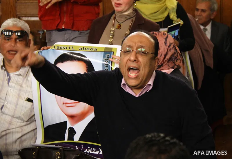 A supporter of former Egyptian president Hosni Mubarak shouts slogans at the High Court where Mubarak's trial will take place, in Cairo, Egypt, April 7, 2016. Photo by Stranger
