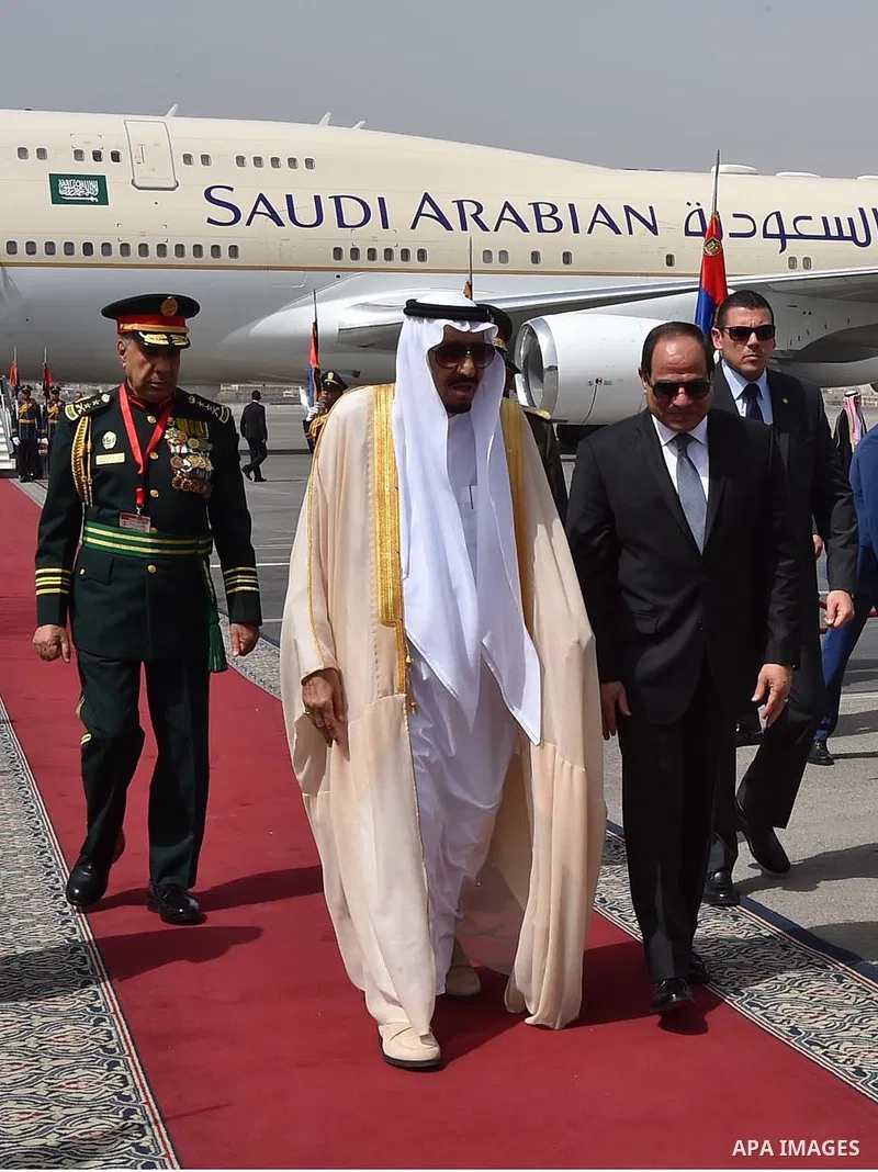 Egyptian President Abdel Fattah al-Sisi welcoming Saudi King Salman bin Abdulaziz upon his arrival at Cairo's international airport on April 07, 2016. Saudi King Salman started a five-day visit to Cairo in a show of supp...