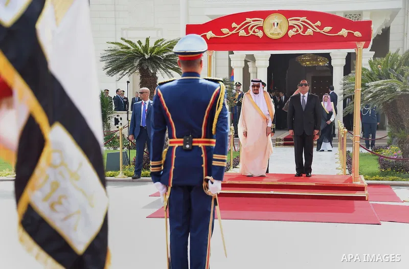 Egyptian President Abdel Fattah al-Sisi and Saudi King Salman bin Abdulaziz reviewing troops before a meeting in the capital Cairo on April 07, 2016. Saudi King Salman started a five-day visit to Cairo in a show of suppo...