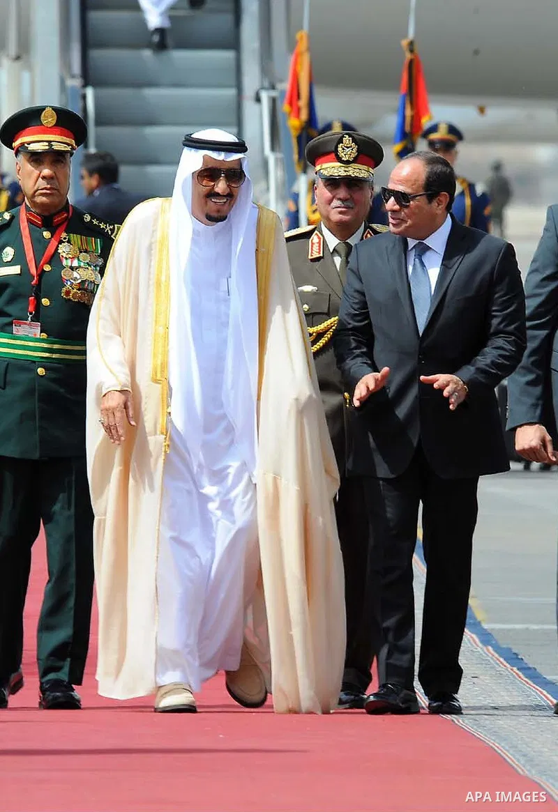 Egyptian President Abdel Fattah al-Sisi welcoming Saudi King Salman bin Abdulaziz upon his arrival at Cairo's international airport on April 07, 2016. Saudi King Salman started a five-day visit to Cairo in a show of supp...