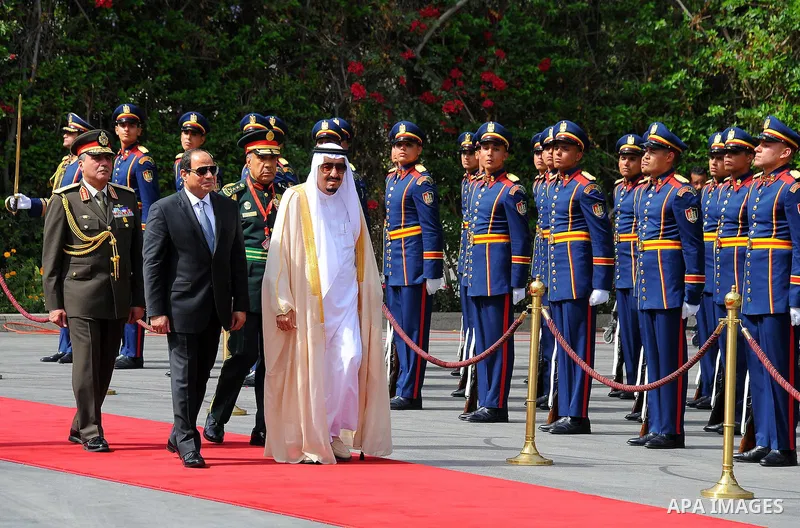 Egyptian President Abdel Fattah al-Sisi and Saudi King Salman bin Abdulaziz reviewing troops before a meeting in the capital Cairo on April 07, 2016. Saudi King Salman started a five-day visit to Cairo in a show of suppo...