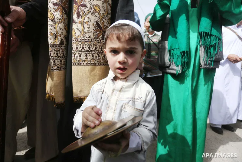 Palestinians perform during a festival at the mosque of Nabi Musa, where the tomb of Prophet Moses is believed to be placed, in the Judean Desert neat the West Bank town of Jericho, on April 8, 2016. The festival sponsor...