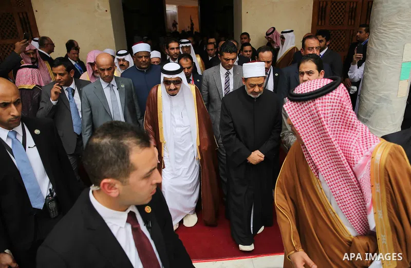 A handout picture made available by al-Azhar media center on April 9, 2016 shows the Grand Imam of al-Azhar Sheikh Ahmed al-Tayeb and Saudi King Salman bin Abdulaziz visiting the mosque at al-Azhar headquarters, the most...