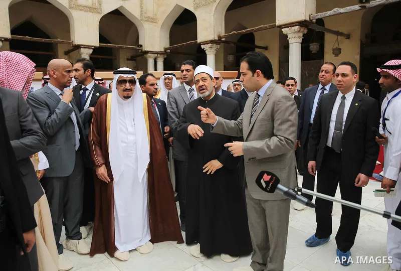 A handout picture made available by al-Azhar media center on April 9, 2016 shows the Grand Imam of al-Azhar Sheikh Ahmed al-Tayeb and Saudi King Salman bin Abdulaziz visiting the mosque at al-Azhar headquarters, the most...