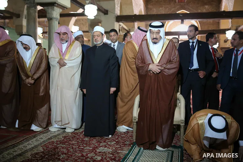 A handout picture made available by al-Azhar media center on April 9, 2016 shows the Grand Imam of al-Azhar Sheikh Ahmed al-Tayeb and Saudi King Salman bin Abdulaziz visiting the mosque at al-Azhar headquarters, the most...
