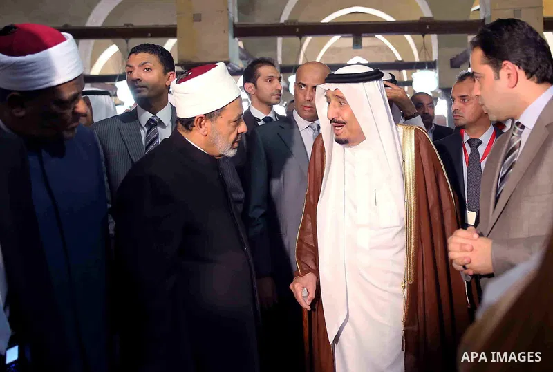 A handout picture made available by al-Azhar media center on April 9, 2016 shows the Grand Imam of al-Azhar Sheikh Ahmed al-Tayeb and Saudi King Salman bin Abdulaziz visiting the mosque at al-Azhar headquarters, the most...