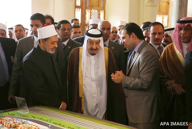 A handout picture made available by al-Azhar media center on April 9, 2016 shows the Grand Imam of al-Azhar Sheikh Ahmed al-Tayeb and Saudi King Salman bin Abdulaziz visiting the mosque at al-Azhar headquarters, the most...