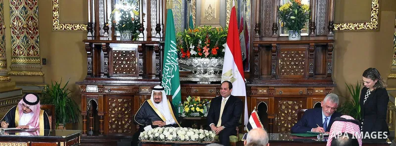 A handout picture released by the Egyptian Presidency on April 10, 2016 shows Egyptian President Abdel Fattah al-Sisi meeting with Saudi King Salman bin Abdulaziz as part of a signing ceremony for bilateral aggrements at...