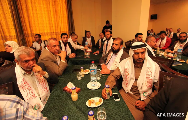 Palestinians attend a meeting of the International Forum of Parliament, in Gaza city, on April 10, 2016. Photo by Ashraf Amra