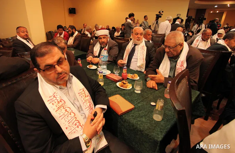 Palestinians attend a meeting of the International Forum of Parliament, in Gaza city, on April 10, 2016. Photo by Ashraf Amra