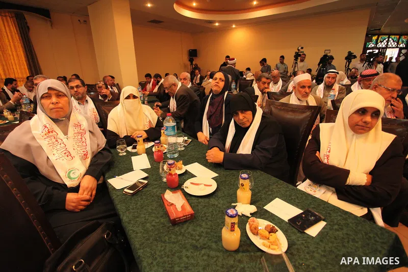 Palestinians attend a meeting of the International Forum of Parliament, in Gaza city, on April 10, 2016. Photo by Ashraf Amra