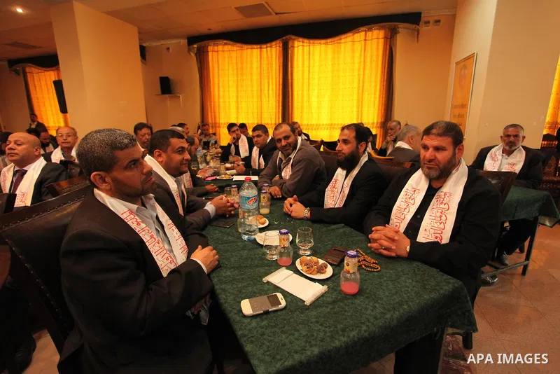 Palestinians attend a meeting of the International Forum of Parliament, in Gaza city, on April 10, 2016. Photo by Ashraf Amra